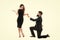Last romantic on the Earth. Why do men get down on one knee to propose. Proposal of marriage concept. Man hold red box