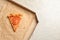 Last slice of cheese pizza in cardboard box on grey, top view with space for text. Food delivery service