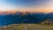 Last soft sunlight over rocky mountain peaks, ridges and valleys of the Alps at sunrise. Extreme terrain landscape at high altitud