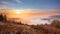 The last warm rays of the sun meet the cool fog over the Murg valley in the Black Forest