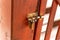 Latch with lock bolt metal on a wooden door for home protection closeup