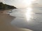 late afternoon in the beach in Deshaies, people swimming in the background