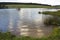 Late afternoon next to the waters of a peaceful country dam.