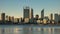 Late afternoon shot of the skyline of perth and a ferry on the swan river