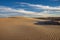 The late afternoon sun casts shadows across the sand dunes at Adolfo Lopez Mateos in Baja California