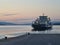 A late ferry coming to a pier for the last passengers