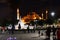 Late night walkers view the lighted Hagia Sophia