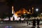 Late night walkers view the lighted Hagia Sophia