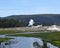 Late Spring in Yellowstone: Looking Downstream and Across the Firehole River to an Erupting Castle Geyser in Upper Geyser Basin