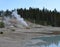 Late Spring in Yellowstone National Park: Black Growler Steam Vent with the Scummy Pool in the Foreground in the Porcelain Basin A