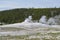 Late Spring in Yellowstone National Park: Old Faithful Geyser Begins to Erupt in Upper Geyser Basin