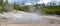 Late Spring in Yellowstone National Park: Steam Rolls Off Echinus Geyser in the Back Basin Area of Norris Geyser Basin