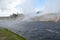 Late Spring in Yellowstone National Park: Steam Rolls Off Excelsior Geyser Crater Next to Firehole River in Midway Geyser Basin