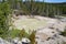 Late Spring in Yellowstone National Park: Turbulent Pool Next to Sulphur Caldron Along the Grand Loop Road