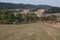 Late summer landscape in the picturesque Kaczawskie Mountains. Cultivated fields after the harvest, meadows with grazing cows.