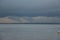 Late summer strolling over the sands on the beaches of Whitstable, Kent, UK taking in the sights and patterns in the sand made by