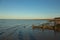 Late summer strolling over the sands on the beaches of Whitstable, Kent, UK taking in the sights and patterns in the sand made by