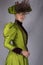 Late Victorian woman in green silk ensemble