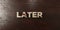 Later - grungy wooden headline on Maple - 3D rendered royalty free stock image