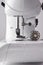 Lateral detail sewing machine needle and thread spool