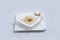 Lateral Hero Shot of a Mushroom Soup with bread crumbs, oregano on a minimal white background with a 45 degree angle