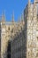 Lateral part of the famous Milan Cathedral, called `White Gothic masterpiece.`