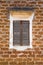 Laterite wall background with vintage wooden windows. Retro style