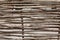 Lath fence of twigs wooden texture