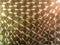 lathe cut brass hex rods laid out tightly - full frame industrial background