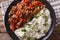 Latin American cuisine: ropa vieja with rice close-up.