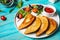 Latin American, mexican, chilean food. Traditional baked pastry empanadas with beef meat on a blue wooden background