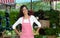 Latin american woman selling vegetables and salad at farmers mar