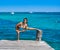 Latin athlete woman stretching in Caribbean