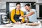 Latin couple bakers preparing dough for baking mexican bread called Conchas in kitchen in Mexico city