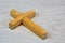 Latin cross on wooden background. Cross religious attribute of a geometric figure. In many beliefs carries sacral meaning - is