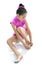 Latin cute young little girl in dancing practice putting on ballet shoe