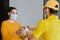 Latin delivery man with mask holding and carrying a cardbox in quarantine coronavirus pandemic