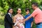 Latin Family holds mother`s hands on her pregnant belly