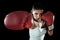 Latin fitness woman with girl red boxing gloves posing in defiant and competitive fight attitude