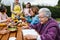 Latin grandmother and granddaughter, daughter cooking mexican food at home, three generations of women in Mexico