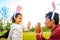 latin hispanic father and mixed race little girl playing rabbit and hare outdoor