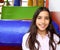 Latin indian teen girl smiling in playground