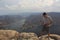 Latin man explorer in the viewpoint El Vigilante and in the background the Zimapan dam in Hidalgo Mexico