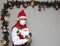 Latin man with protection mask and santa claus doll in christmas decoration, new normal covid-19