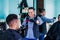 Latin man stylist cutting hair to a client in a barber shop in Mexico