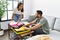 Latin man and woman couple smiling confident prepare travel suitcase at home