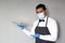 Latin mature man with tray and glasses, works with latex gloves and covers, new normal for covid-19 virus