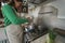 Latin mature woman cooking in old vintage kitchen - Smiling mother preparing lunch