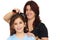 Latin mother combing small daughter\'s hair