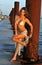 Latin swimsuit fashion model posing at boat marina